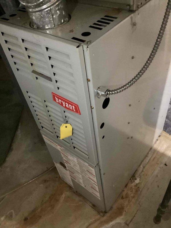 Completed preventative maintenance tune-up on residential cooling system located at rear of property. Performed comprehensive inspection of outdoor condenser unit and indoor Bryant furnace with cooling coil, checking refrigerant levels, electrical connections, and airflow components. All systems tested and found operating within normal parameters; unit left in proper working condition.