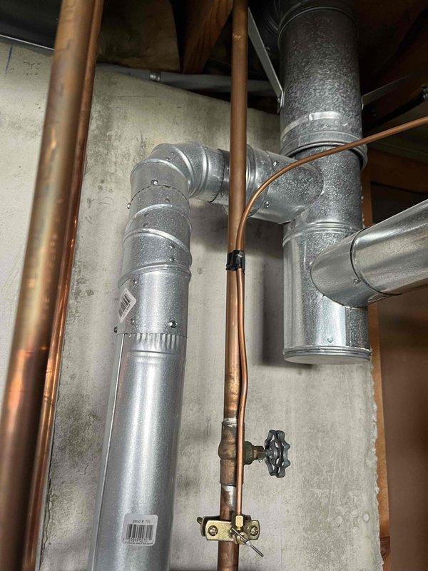 Installed a 50-gallon gas tall water heater in a 23-year-old residence, replacing the existing unit. Installation included setting up the new heater with a 3/4-inch pressure reducing valve (PRV), connecting copper supply lines, and ensuring proper venting through the existing HVAC infrastructure. Work was completed in compliance with City of Wentzville permit requirements, with all plumbing connections secured and tested for proper operation.