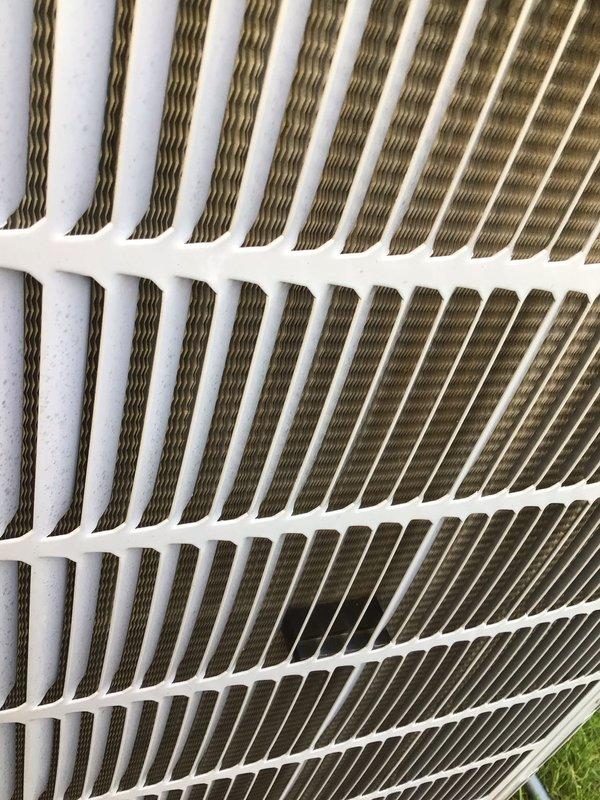 Completed comprehensive tune-up service on a 9-year-old residential air conditioning unit located at side of home. Performed standard maintenance procedures including inspection of outdoor condenser unit with ventilation grille, examination of blower motor assembly and electrical connections, and verification of all mechanical components for proper operation. System evaluated and confirmed to be functioning within normal parameters.