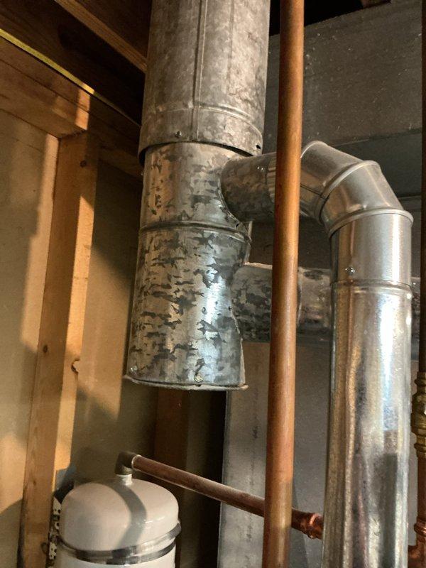 Replaced defective 6x4x3 swivel tee fitting in the ductwork system located in the basement utility area. The old galvanized component showed signs of age and wear, and was removed and replaced with new metallic transition ductwork to restore proper airflow and system function. System tested and confirmed operational for both heating and cooling modes upon completion.