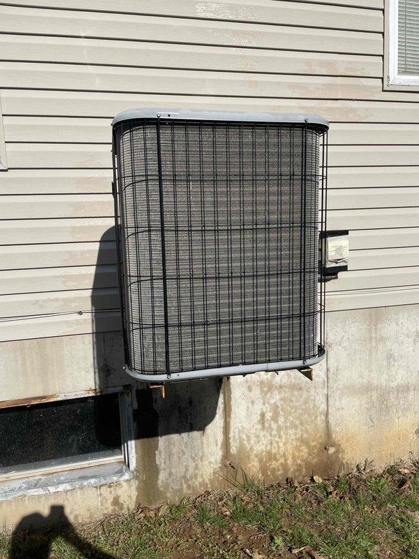 Completed cooling system tune-up on single residential unit located at side of home. Performed comprehensive maintenance including inspection of outdoor condenser unit with cylindrical design and protective mesh grille, verified unit operation and refrigerant levels. Inspected and documented 20x25x1 air filter with MERV 300 rating inside air handler compartment, noting pleated filter condition. System tested and confirmed operational within manufacturer specifications for unit under 10 years of age.