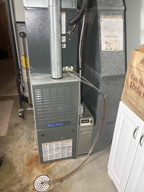Completed blower motor replacement on American Standard furnace system. Installed new motor, tested system operation, and verified proper heating and cooling functionality. Removed and disposed of failed blower motor component per standard protocol.