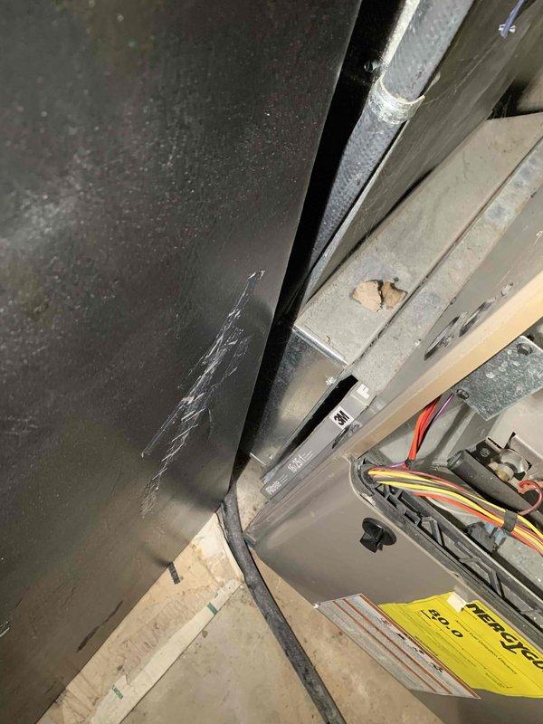 Completed comprehensive tune-up service on a 32-year-old residential air conditioning unit located in backyard under Home Depot service contract. Performed standard maintenance protocol including inspection of electrical control board, wiring connections, and internal components within equipment housing. All systems evaluated and found operational with documentation photos captured of circuit board and internal wiring configuration for service records.