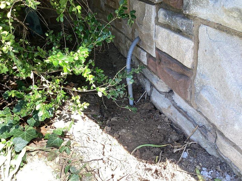 Completed electrical fixture installation at residential property. Technicians arrived on-site and collected payment for previously approved estimate before commencing work. Installation included exterior and interior electrical fixtures with associated wiring and mounting hardware. Exterior work involved proper fixture mounting to building foundation with appropriate weatherproofing and conduit installation. Interior basement installation required routing electrical wiring through floor joists and structural beams, ensuring proper clearances from plumbing lines and maintaining code-compliant spacing. All fixtures were tested for proper operation and electrical connections were verified for safety and functionality. Job site was photographed for documentation purposes upon completion.