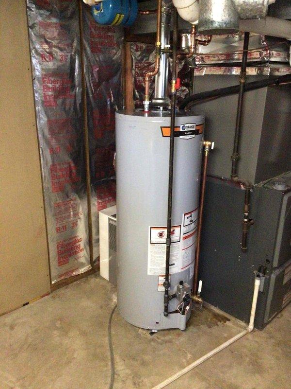 Installed 50-gallon tall gas water heater in basement utility area, connecting all supply and discharge plumbing lines with copper piping and appropriate fittings. Installed metallic flue pipe venting system connecting unit to existing ductwork, ensuring proper draft and code compliance. Completed installation per City of Ballwin permit requirements, with all connections tested and unit operational.