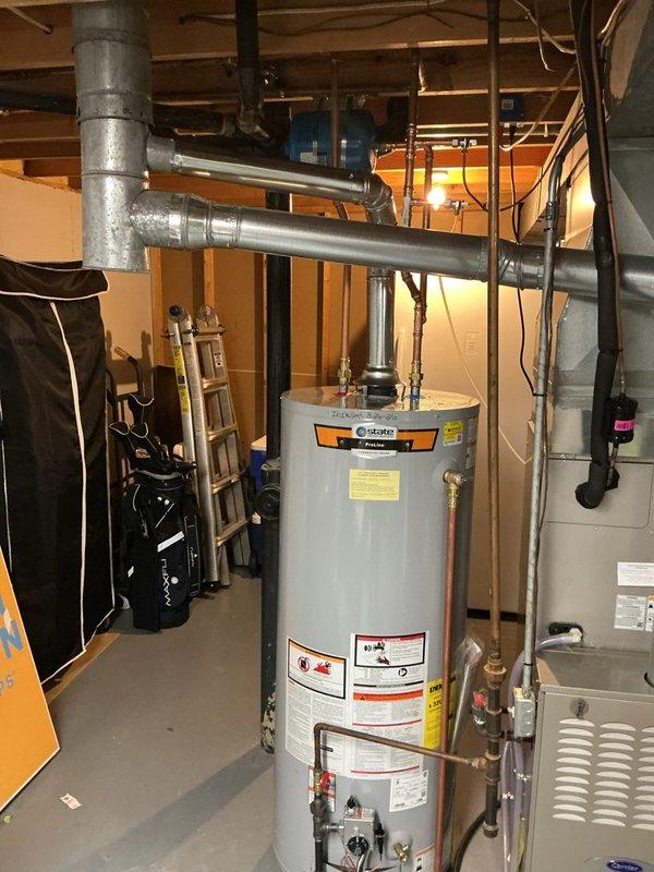 Successfully installed a 50-gallon tall gas water heater in basement utility area. Connected all necessary copper piping, pressure relief valve, and gas line to manufacturer specifications. Verified proper venting and clearances from adjacent HVAC equipment. Applied permit identification sticker per permit #26PLU-05614. Unit tested and operational with all safety controls functioning correctly.
