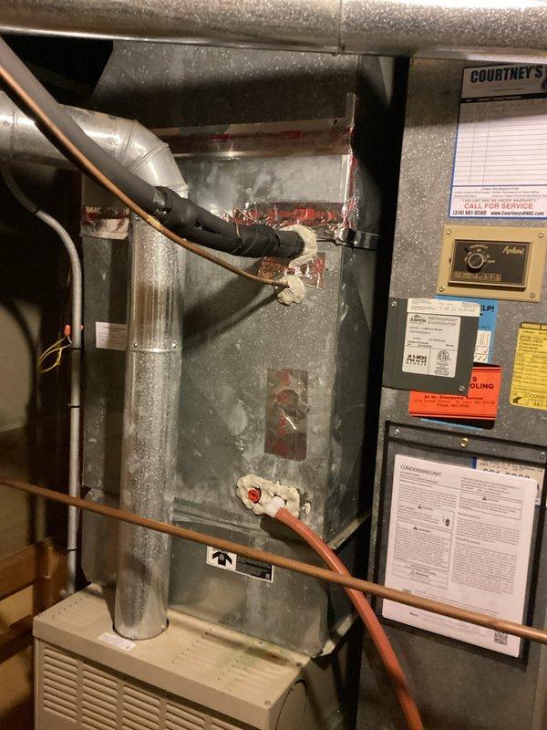 Responded to no cooling complaint on 4-year-old residential system. Upon inspection, found severely restricted airflow due to dirty air filter causing reduced cooling capacity. Removed and photographed heavily loaded filter from air handler unit located in basement mechanical room. Replaced filter with new pleated media filter. Verified proper airflow restoration and system operation. Unit returned to normal cooling function.