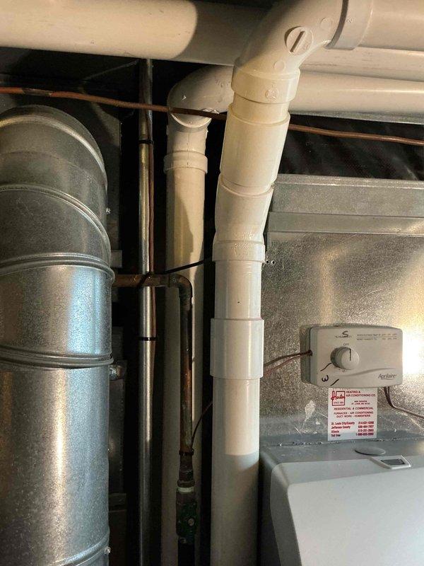 Completed flue pipe repair on residential HVAC system using 2.5-inch PVC materials including 5-foot pipe section, 90-degree elbow, and coupling fittings. Repaired and secured exhaust venting to restore proper combustion gas evacuation from heating equipment. System tested and confirmed operational with adequate draft and safe venting.
