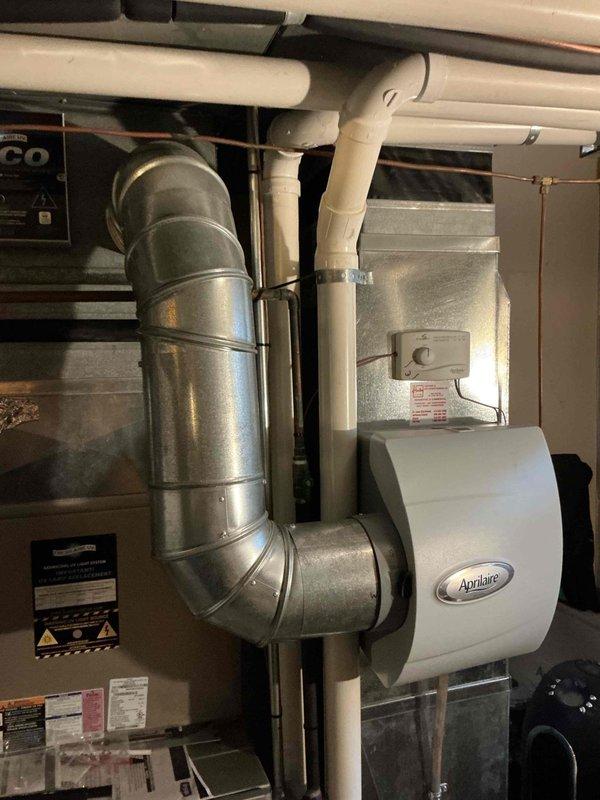 Completed flue pipe repair on residential HVAC system using 2.5-inch PVC materials including 5-foot pipe section, 90-degree elbow, and coupling fittings. Repaired and secured exhaust venting to restore proper combustion gas evacuation from heating equipment. System tested and confirmed operational with adequate draft and safe venting.