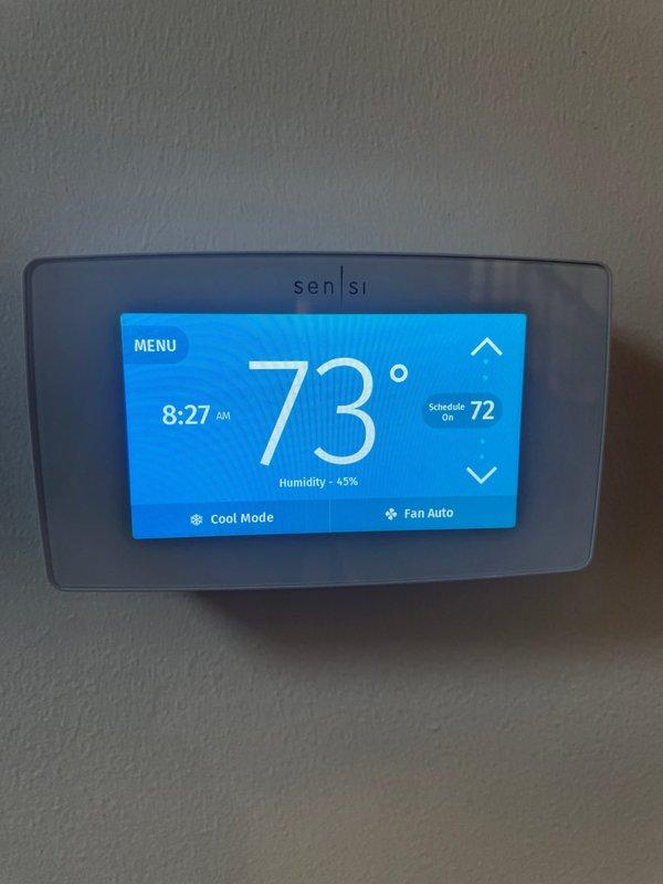 Responded to no-cool complaint on 5-year-old system struggling to maintain setpoint. Upon inspection, found indoor air handler with significant condensation and frost accumulation on lower cabinet section, indicating restricted airflow across evaporator coil. Thermostat displayed 73°F actual temperature with 72°F setpoint in cooling mode. Diagnosed severely restricted airflow due to clogged air filter causing evaporator coil to freeze and reducing system capacity. Replaced dirty air filter with new filter, allowed coil to thaw completely, and verified proper airflow restoration. System cycled properly with adequate cooling capacity and temperature differential upon restart. Advised homeowner on importance of regular filter maintenance to prevent future freeze-ups and capacity issues.