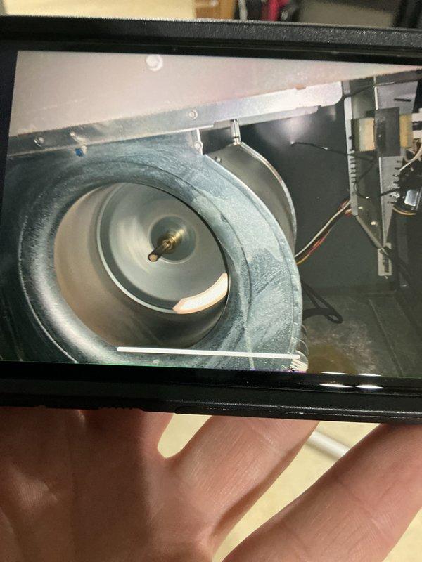 Completed annual cooling maintenance tune-up on residential air conditioning system. Performed comprehensive inspection of air handler unit, including blower assembly and centrifugal fan wheel, which were found to be in good operating condition with normal dust accumulation. Replaced dirty pleated air filter with visible debris buildup to restore proper airflow and system efficiency. Verified all electrical connections, control board functionality, and mechanical components. System tested and confirmed operating properly upon completion of maintenance service.