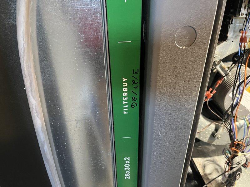 Responded to service call for 10-year-old geothermal system in basement producing loud whining noise. Upon inspection, identified dirty and restrictive air filter as primary cause of abnormal system sounds and reduced airflow. Replaced existing filter with new Flanders pleated media filter to restore proper air circulation and eliminate noise issue. System tested and operating normally after filter replacement.