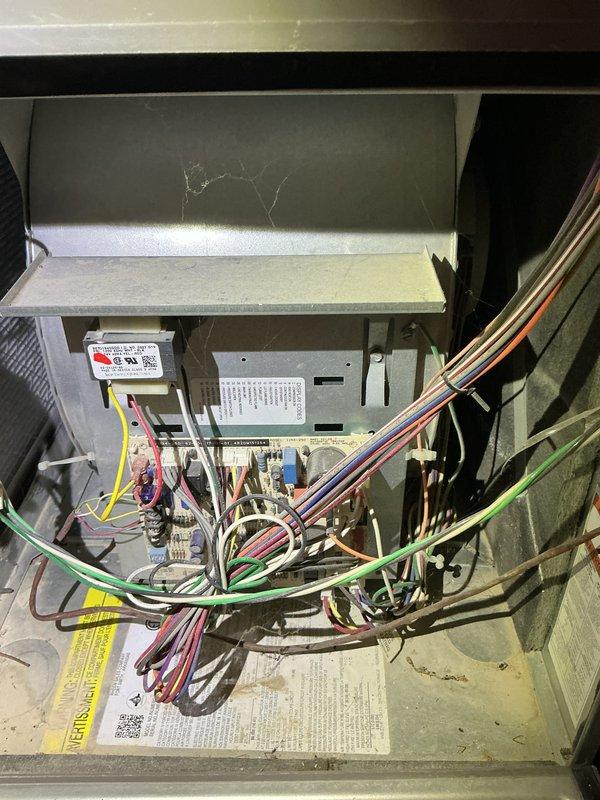 # HVAC Service - No Cool U10

Responded to service call for complete system failure affecting both air conditioning and heating units. Upon arrival, performed diagnostic evaluation of 6-year-old split system with ground-level condenser and basement furnace installation. 

Conducted comprehensive electrical troubleshooting to identify root cause of no-power condition affecting both units. Inspected furnace control board, examined wiring connections, and verified thermostat communication. Removed access panels to access internal components and control systems. Evaluated heat exchanger condition and inspected blower compartment for potential mechanical or electrical faults.

Traced low-voltage and line-voltage circuits to isolate the failure point preventing system operation. Checked transformer output, control board functionality, and safety switch circuits. Documented existing equipment condition through photographic records showing internal component arrangement, wiring configuration, 