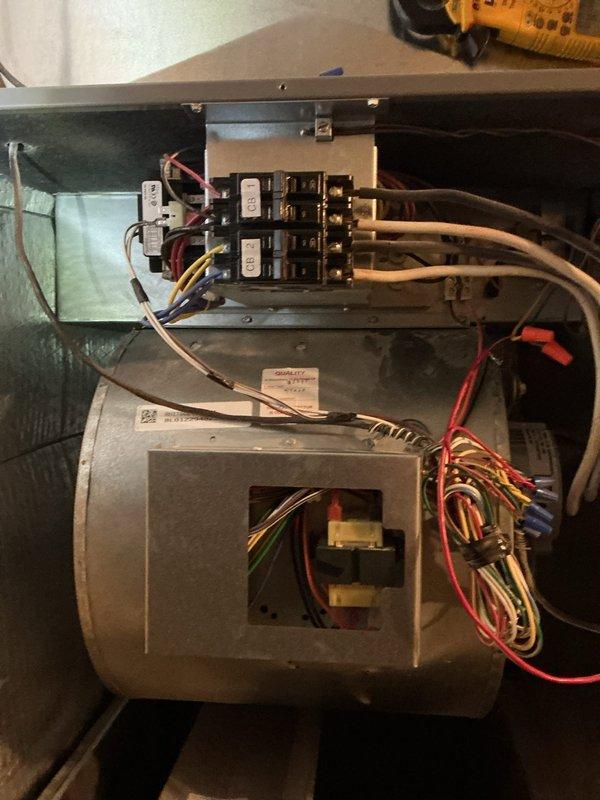 Responded to no heat call on a single-zone electric HVAC system. Upon inspection, accessed the unit's electrical cabinet and reviewed the 240V single-phase, 20KW 2-stage heating system wiring schematic and component layout. Performed diagnostic evaluation of the circuit breaker panel, blower assembly, and heating elements to identify the cause of insufficient heat output. Documented existing equipment configuration including capacitor, transformer, and control wiring for service records.
