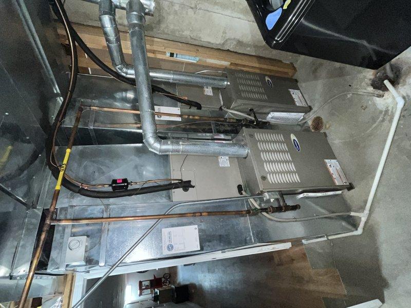 Responded to service call for non-functioning thermostat on second-floor unit over 10 years old. Upon inspection, diagnosed complete thermostat failure with no display or power. Performed system evaluation of existing HVAC equipment including furnace, air handler, and associated ductwork in basement installation. Documented equipment condition and electrical connections for diagnostic purposes. Provided customer with repair options and recommendations for thermostat replacement to restore system functionality.