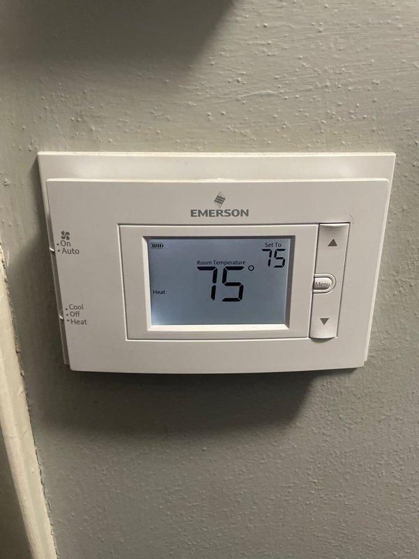 Responded to service call for AC unit running continuously with compressor not cycling off. Upon arrival, verified thermostat was calling for cooling with room temperature matching setpoint at 75 degrees, indicating potential thermostat malfunction or wiring issue preventing proper system communication. Inspected electrical panel to verify proper breaker operation and power supply to HVAC system. Diagnosed issue as faulty thermostat failing to break circuit when temperature setpoint was reached, causing compressor to run non-stop. Recommended thermostat replacement to restore proper system cycling and prevent compressor damage from continuous operation.