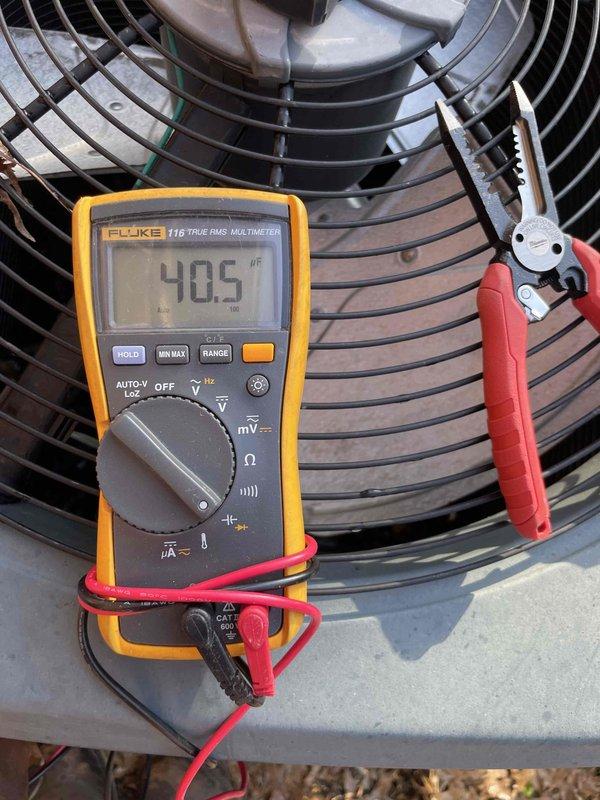 Completed comprehensive cooling season tune-up on 10-year-old ground-level AC condenser unit. Performed standard preventive maintenance protocol including visual inspection of ductwork components, capacitor testing with digital multimeter (measured 405 μF), and evaluation of condenser fan assembly operation. All components found operating within normal parameters with routine dust accumulation noted on exterior surfaces.