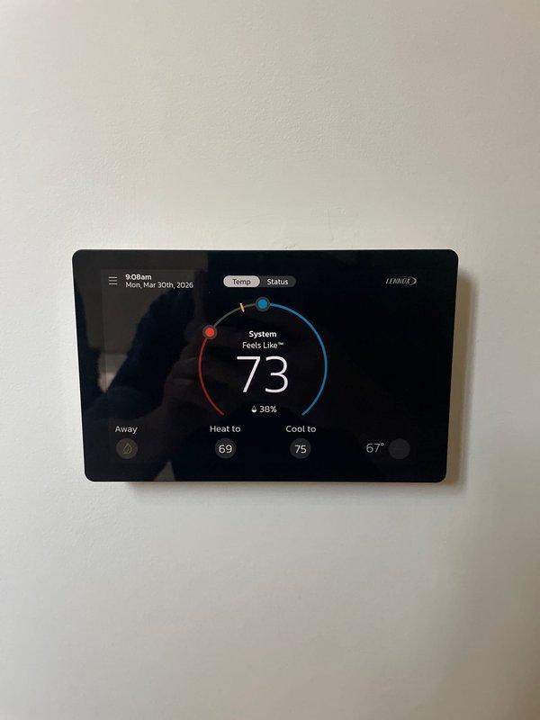 Responded to service call for thermostat displaying blank screen. Upon arrival, performed diagnostic evaluation of Lennox digital thermostat and wiring connections. Removed thermostat from wall plate to inspect terminal block and verify proper wire connections including R, Y, G, and W terminals. Found loose wire connection causing intermittent power loss to display. Secured all wiring connections at terminal block, reinstalled thermostat to wall plate, and restored power. Verified thermostat display functioning properly with temperature reading of 73°F, system status indicators operational, and heating/cooling setpoints responding correctly. Tested system communication and confirmed full functionality. Unit operational at time of departure.