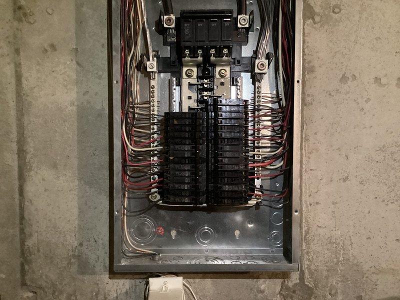 Completed comprehensive electrical inspection of residential property. Performed thorough examination of main electrical panel, verifying proper circuit breaker configuration, wire routing, and connection integrity throughout the distribution system. Inspected basement lighting fixtures and evaluated exposed wiring conditions in unfinished areas to ensure compliance with safety standards.