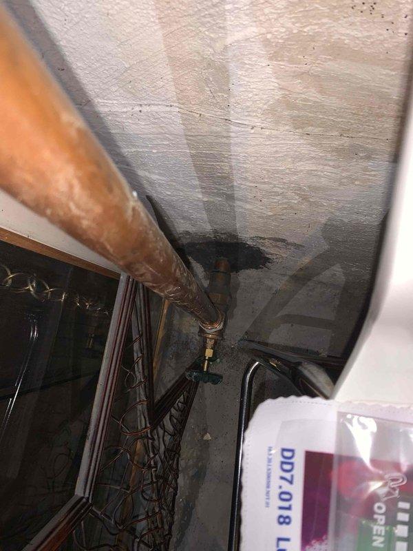 Completed comprehensive electrical inspection of residential property, focusing on main electrical panel and utility space conditions. Evaluated circuit breaker configuration, wire connections, and grounding system within the main distribution panel, noting proper wire routing and terminal connections. Documented moisture damage to ceiling surfaces in mechanical space and assessed potential impact on electrical infrastructure, including exposed wiring bundles and copper plumbing lines in proximity to electrical components. Inspected outlet functionality and verified proper grounding connections throughout affected areas.