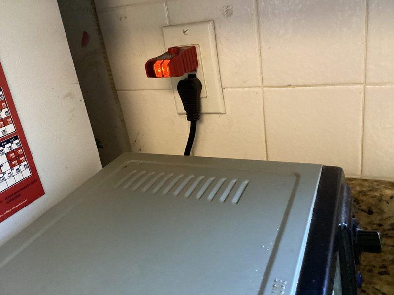 Completed comprehensive electrical safety inspection for member as part of preventative maintenance program. Inspected main electrical panel in utility area, verifying proper installation, labeling, and secure mounting between wall studs. Evaluated kitchen electrical outlets and connections, noting multiple appliances in use on backsplash receptacle. Documented all findings with photographs for service records. No immediate repairs required at time of inspection.