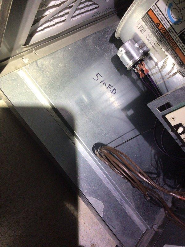 Completed comprehensive Supertune U10 maintenance on a 9-year-old heat pump system located in basement with outdoor condenser unit. Performed full system inspection including electrical connections, refrigerant pressures, and component functionality. Identified and documented 5 MFD capacitor rating during inspection of air handler interior components. Verified proper condensate drainage through PVC piping system and inspected copper refrigerant lines for integrity. Noted significant condensation present on metallic supply ductwork, indicating system is operating and producing cold air effectively. Cleaned and inspected blower assembly, checked all safety controls, and tested thermostat operation. Applied appropriate treatment to coils and verified proper airflow throughout system. All components functioning within manufacturer specifications at time of service completion.