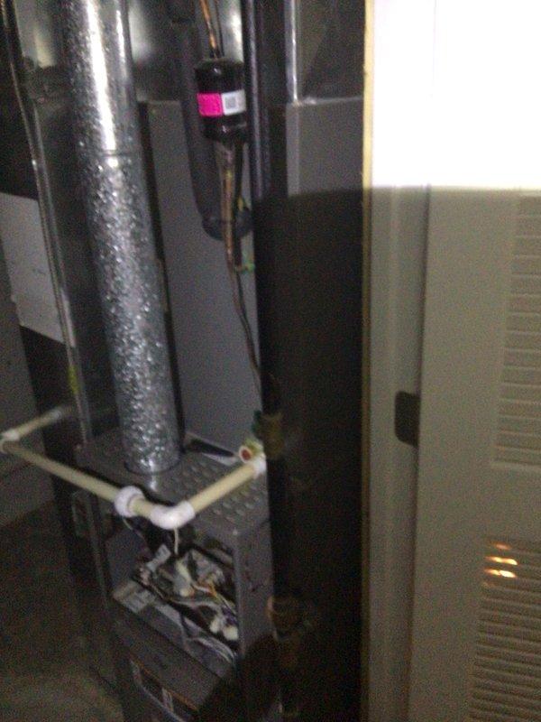 Completed comprehensive Supertune U10 maintenance on a 9-year-old heat pump system located in basement with outdoor condenser unit. Performed full system inspection including electrical connections, refrigerant pressures, and component functionality. Identified and documented 5 MFD capacitor rating during inspection of air handler interior components. Verified proper condensate drainage through PVC piping system and inspected copper refrigerant lines for integrity. Noted significant condensation present on metallic supply ductwork, indicating system is operating and producing cold air effectively. Cleaned and inspected blower assembly, checked all safety controls, and tested thermostat operation. Applied appropriate treatment to coils and verified proper airflow throughout system. All components functioning within manufacturer specifications at time of service completion.