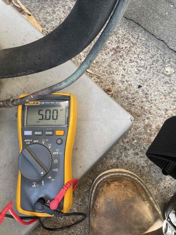 Completed comprehensive tune-up service on a 7-year-old residential air conditioning unit located at ground level. Performed standard maintenance protocol including electrical diagnostics using digital multimeter and clamp meter to verify proper voltage and amperage draw across system components. All measurements confirmed unit operating within manufacturer specifications, with electrical readings stable and within normal parameters for continued safe operation.