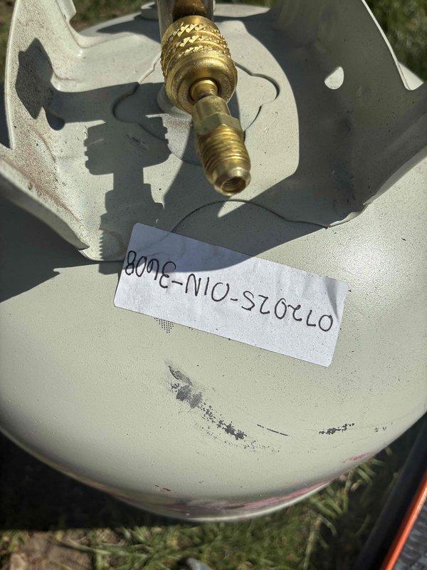 Responded to callback for newly installed AC unit experiencing short cycling. Upon arrival, performed diagnostic testing of the system using digital multimeter. Verified unit was powering on briefly before shutting down. Inspected outdoor condensing unit and confirmed proper equipment identification and labeling. Conducted voltage and amperage readings which displayed 25 on meter during testing. Documented equipment serial number and system components with photos for service records. Troubleshot electrical connections and system controls to identify root cause of premature shutdown issue. Resolved short cycling condition and verified system operation returned to normal parameters.