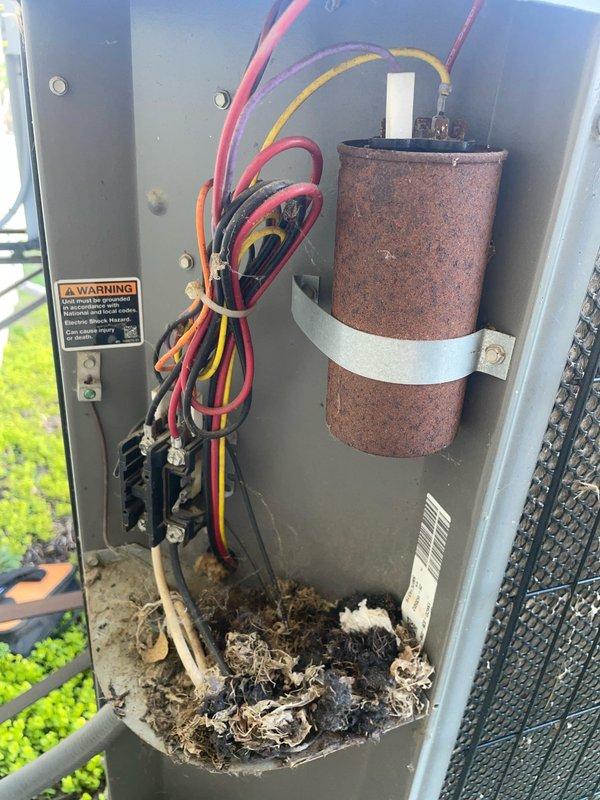 Responded to call for water leaking from furnace during air conditioning operation. Upon inspection, identified clogged condensate drain line as source of water leakage. Cleared blockage from drain line and verified proper drainage flow. Noted significant debris accumulation in outdoor unit cabinet and rust present on capacitor housing. Cleaned debris from base of equipment and checked all electrical connections. Tested system operation to confirm AC cooling cycle running properly with no further water leakage. Discussed preventative maintenance agreement options with customer to address ongoing equipment maintenance needs and prevent future service issues.