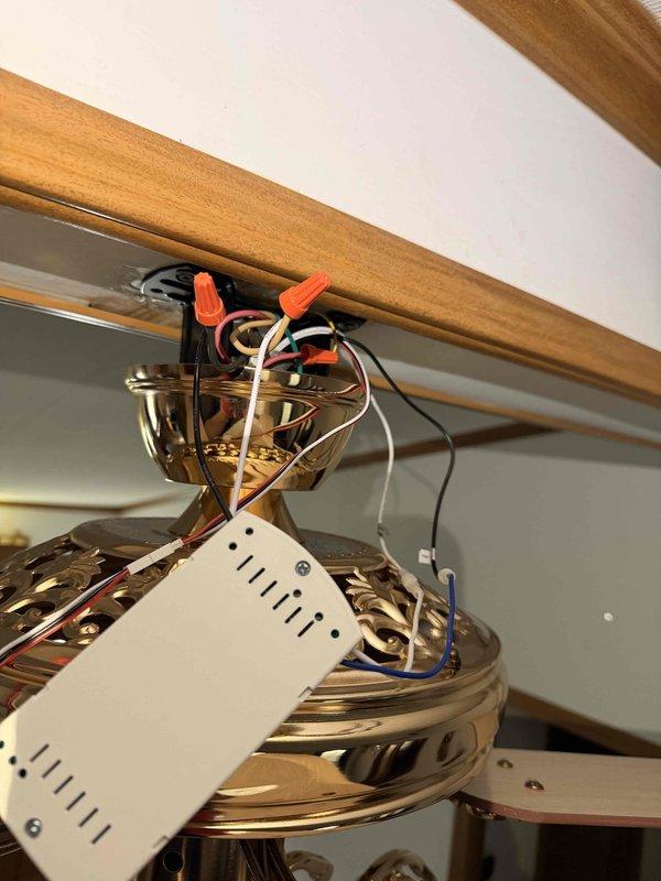 Responded to service call for ceiling fan installation assistance after homeowner experienced electrical shock while attempting DIY installation. Upon arrival, assessed existing wiring configuration and identified improper connections that posed shock hazard. Disconnected all existing wiring, verified circuit was de-energized, and properly secured all wire connections using appropriate wire nuts per NEC standards. Mounted ceiling fan motor housing to existing electrical box, ensuring secure mechanical attachment. Connected hot, neutral, and ground conductors following manufacturer specifications and color-coded wiring diagram. Verified all connections were tight and properly insulated. Tested fan operation at all speed settings to confirm proper electrical function and mechanical stability. Installation completed safely with all wiring concealed within ceiling canopy.