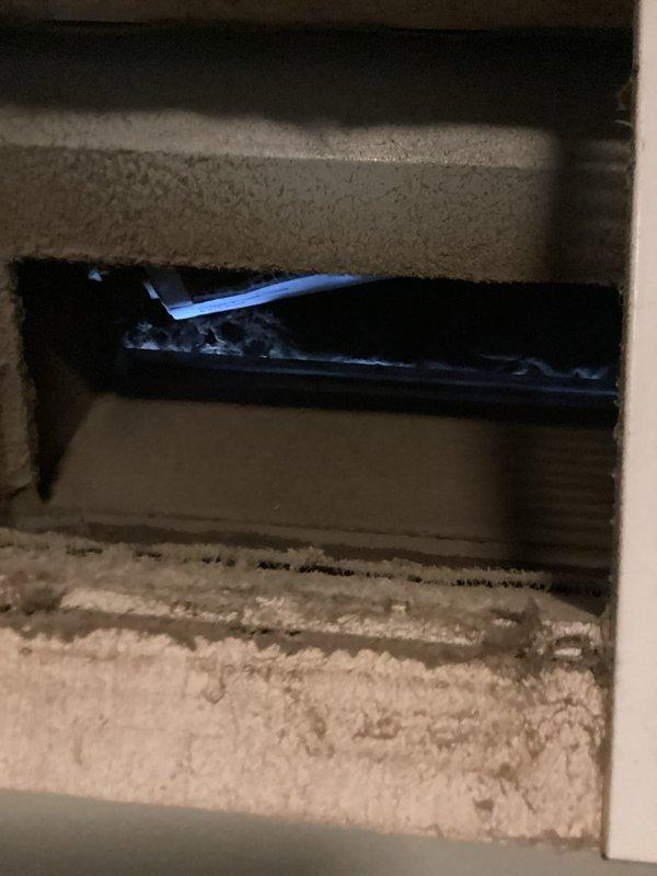 Completed comprehensive cooling system tune-up on 10-year-old outdoor AC unit located in front yard. Performed standard preventive maintenance including system inspection, refrigerant level check, electrical connection testing, condenser coil cleaning, and operational verification. Discovered and documented severely clogged air filter with excessive dirt and debris accumulation, which was restricting airflow and reducing system efficiency. Inspected ductwork opening and noted dust buildup on insulation surfaces near return air pathway. Replaced dirty filter and advised homeowner on proper maintenance intervals to prevent future airflow restrictions and maintain optimal system performance.