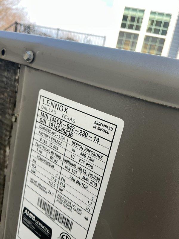 Responded to no cooling call on dual-zone residential HVAC system with 11-year-old Lennox 14ACY condensing unit. Upon arrival, found upstairs zone completely non-operational and main floor zone running but not producing cool air. Performed diagnostic assessment of both zones, inspected rooftop condenser unit, checked electrical connections, verified refrigerant lines, and documented equipment nameplate specifications including model and serial number information. Identified system deficiencies preventing proper cooling operation in both zones and provided recommendations for necessary repairs to restore full functionality to the dual-zone air conditioning system.