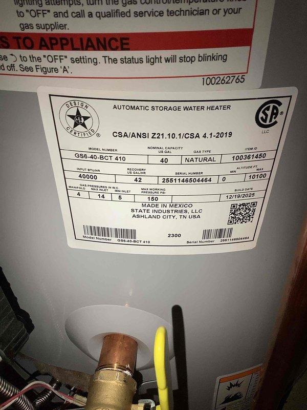 Successfully completed installation of a 40-gallon tall gas water heater (Model G5540-BCT 410) in a confined basement utility space. Due to challenging spatial constraints, a two-technician team removed the existing water heater and positioned the new unit. Installation included connecting copper and galvanized piping with brass fittings to the existing plumbing system, which features a horizontal pressure tank mounted between ceiling joists. A 1-inch pressure reducing valve (PRV) was installed as part of the system upgrade. All connections were properly secured and tested for leaks. Work was performed under permit #26PLU-05909 with required plumbing identification sticker applied per code requirements.