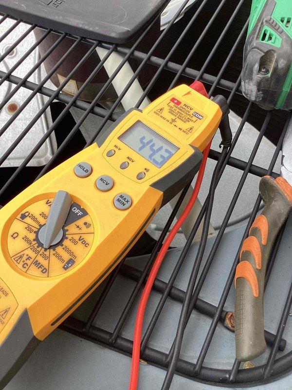 Responded to no cooling call on 10-year-old Amana system. Found thermostat successfully triggering indoor blower motor, but outdoor compressor unit failing to operate. Performed diagnostic testing with multimeter on outdoor unit components to identify electrical failure preventing compressor operation. Diagnosed and resolved issue, restoring proper cooling function to system.