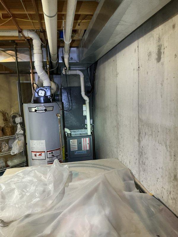Responded to no cooling call on 2014 outdoor condensing unit with thermostat displaying outdoor temperature sensor error. Upon arrival, inspected HVAC system including basement-installed air handler and outdoor condenser unit. Diagnosed faulty outdoor temperature sensor with disconnected or broken wiring preventing system operation. Repaired sensor wiring connection, verified proper communication between thermostat and equipment, and restored system to normal cooling operation. Unit tested successfully with all components functioning as designed.