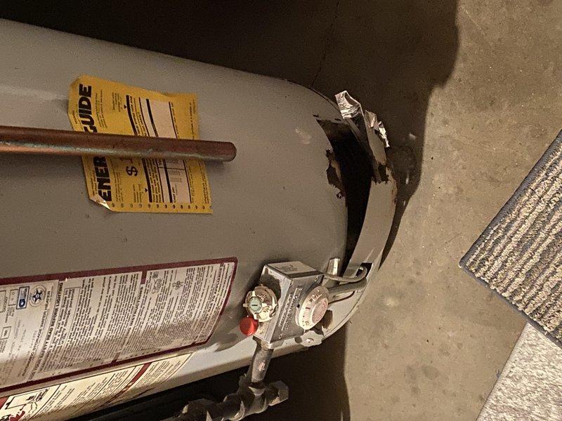 Replaced 20-year-old gas water heater with new 50-gallon gas tall unit in basement. Installed 3/4-inch pressure reducing valve (PRV) with gauge assembly on incoming water supply line, reading within normal operating range. Completed installation per permit #26PLU-05910 with required plumbing identification sticker affixed, ensuring all gas connections, water supply lines, temperature and pressure relief valve, and venting met code requirements.