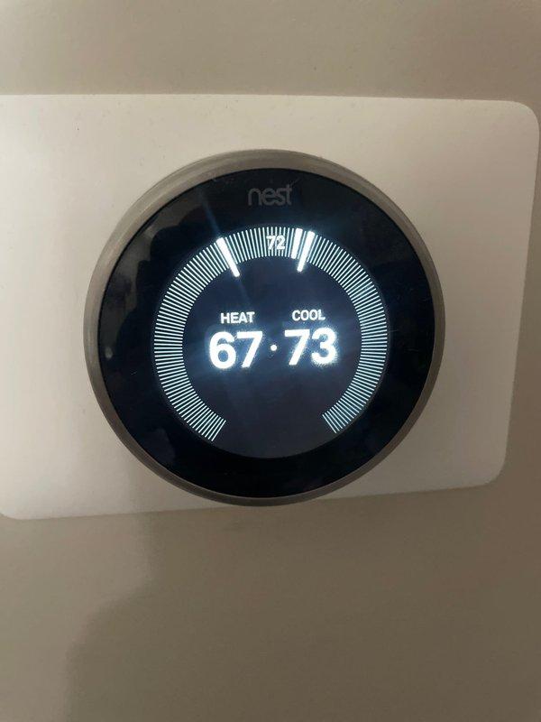 Responded to service call for reduced airflow from AC system. Upon arrival, verified thermostat was calling for cooling with setpoint at 73°F. Inspected Apollo furnace/air handler unit in basement and assessed blower operation, ductwork connections, and filter accessibility. System was running but experiencing diminished air delivery as reported. Documented equipment condition and thermostat settings with photos for service records.