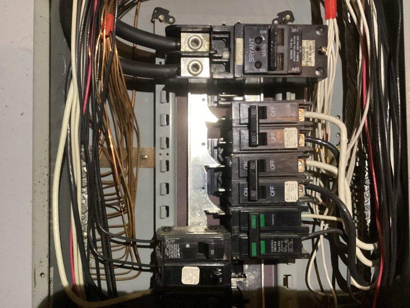 Responded to service call for three non-functioning outlets and potential breaker issue. Upon arrival, performed comprehensive electrical panel inspection and testing. Identified tripped breaker with green indicator in main distribution panel affecting outlet circuit. Reset breaker and verified proper operation. Tested all three reported outlets for proper voltage, grounding, and polarity using multimeter. Found outlets functioning correctly after breaker reset—no replacement necessary. Verified all panel breakers properly seated and secured, checked for signs of overheating or loose connections, and confirmed proper wire terminations throughout panel. All circuits tested within normal operating parameters.