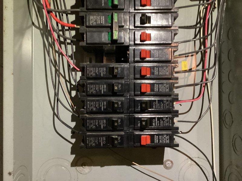 Responded to service call for three non-functioning outlets and potential breaker issue. Upon arrival, performed comprehensive electrical panel inspection and testing. Identified tripped breaker with green indicator in main distribution panel affecting outlet circuit. Reset breaker and verified proper operation. Tested all three reported outlets for proper voltage, grounding, and polarity using multimeter. Found outlets functioning correctly after breaker reset—no replacement necessary. Verified all panel breakers properly seated and secured, checked for signs of overheating or loose connections, and confirmed proper wire terminations throughout panel. All circuits tested within normal operating parameters.