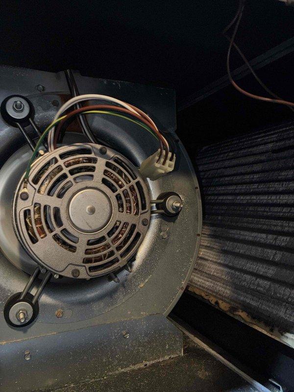 Completed cooling tune-up on 9-year-old attic-mounted air conditioning system. Performed comprehensive inspection of blower motor assembly, verified electrical connections and capacitor operation, checked evaporator coil condition, and measured system temperatures and voltages using diagnostic equipment. All components found operating within normal parameters with no deficiencies noted.