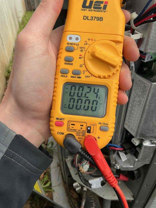 Completed annual cooling maintenance and tune-up on HVAC system. Performed comprehensive system diagnostics using digital multimeter and clamp meter to verify electrical readings, measured supply air temperature at 172.9°F, and confirmed amperage draw at 5.19 amps. All measurements within manufacturer specifications and system operating properly with no deficiencies noted.