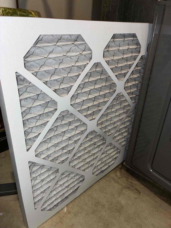 Completed comprehensive cooling tune-up on 8-year-old residential air conditioning unit located at side of home. Performed full system inspection including electrical components, capacitors, and control board functionality; replaced dirty air filter with visible dust and debris accumulation; verified all wiring connections secure and system operating within normal parameters.