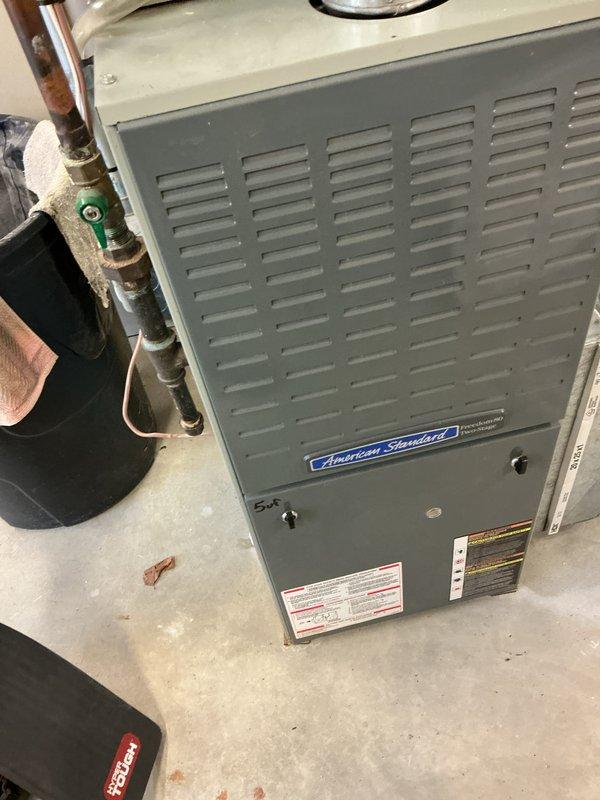 Completed comprehensive air conditioning tune-up on 19-year-old American Standard system located in basement. Performed standard maintenance protocol including filter inspection, refrigerant line examination, and visual assessment of furnace unit and associated ductwork. System operational with all components functioning within normal parameters upon completion of preventive maintenance service.