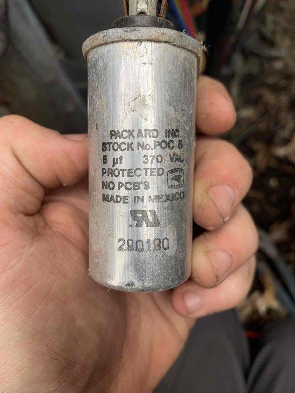 Completed cooling system tune-up on a 10+ year old outdoor unit located in backyard. Inspected and documented electrical components including capacitor showing age-related wear and surface oxidation. Cleared debris accumulation around unit base and verified proper drainage from condensate lines.