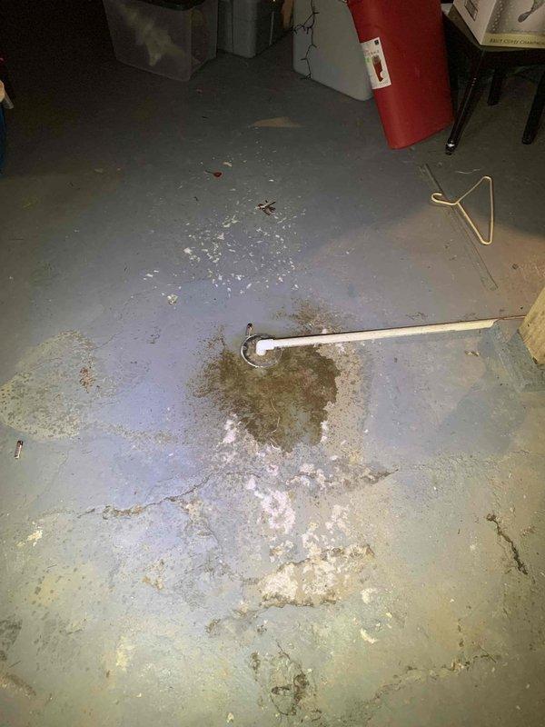 # Plumbing Service - Ground Water Drain

Responded to basement drainage issue where water was actively discharging from floor drain. Upon investigation, determined the problem was directly correlated with HVAC system operation—water level would rise when air conditioning unit was running and recede when system was shut off.

Diagnosed the issue as a condensate drain line improperly connected to or overwhelming the basement floor drain system. Cleared debris and obstructions from the affected drain using appropriate plumbing tools. Inspected condensate drainage pathway and verified proper flow away from the floor drain. Tested system by running the air conditioning unit and confirmed water was no longer backing up through the basement drain. Floor showed evidence of previous water infiltration and staining, consistent with recurring drainage issues prior to service.