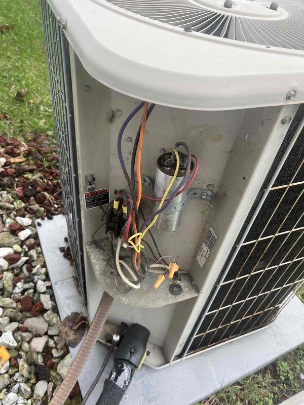 # HVAC Tune-Up Completed

Performed comprehensive preventive maintenance tune-up on a 24-year-old residential air conditioning system located on ground-level concrete pad. Accessed electrical compartment and inspected internal components including capacitor, contactor, and associated wiring connections. Completed standard seasonal maintenance procedures to ensure optimal system performance for the cooling season.