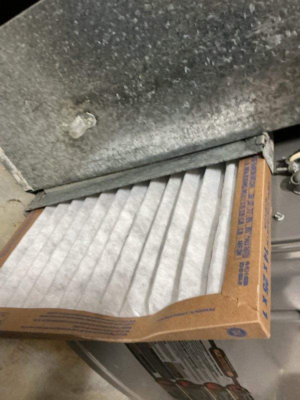 Completed comprehensive tune-up and maintenance service on residential HVAC system per Home Depot work order F58176315. Performed system diagnostics and operational testing, confirming unit functionality with digital measurement instrumentation. Inspected and verified proper air filter installation, noting pleated media filter properly seated in overhead air handler mounting frame with adequate insulation integrity in attic-mounted equipment area.