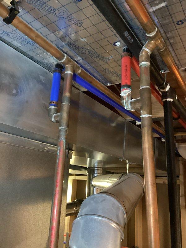 Completed warranty replacement installation of 50-gallon tall gas water heater in basement utility room. Removed existing failed unit, documented warranty information from old equipment per manufacturer requirements, and installed new heater with proper copper piping connections, gas line hookup, pressure relief valve, and venting. All plumbing connections were secured with appropriate fittings and valves, expansion tank verified in proper working position, and unit tested for proper operation and safety compliance.