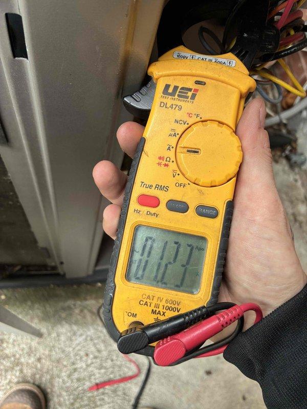 # HVAC Cooling System Tune-Up Completed

Performed comprehensive preventive maintenance tune-up on a 7-year-old residential air conditioning unit located in the backyard. Conducted complete system inspection and diagnostics using calibrated digital multimeter to verify electrical performance and component functionality. Measured capacitance readings on compressor and condenser fan motor capacitors to ensure proper operation within manufacturer specifications. Checked amperage draw on electrical components to confirm system is operating efficiently without excessive current consumption. All electrical connections were inspected and tested for proper voltage and continuity. System components were evaluated for wear and operational efficiency. Unit is functioning properly and ready for cooling season operation. Photographic documentation of diagnostic testing procedures was completed for service records.